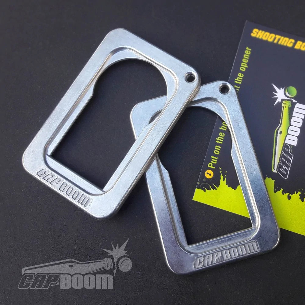 Two capboom bottle openers on the black table