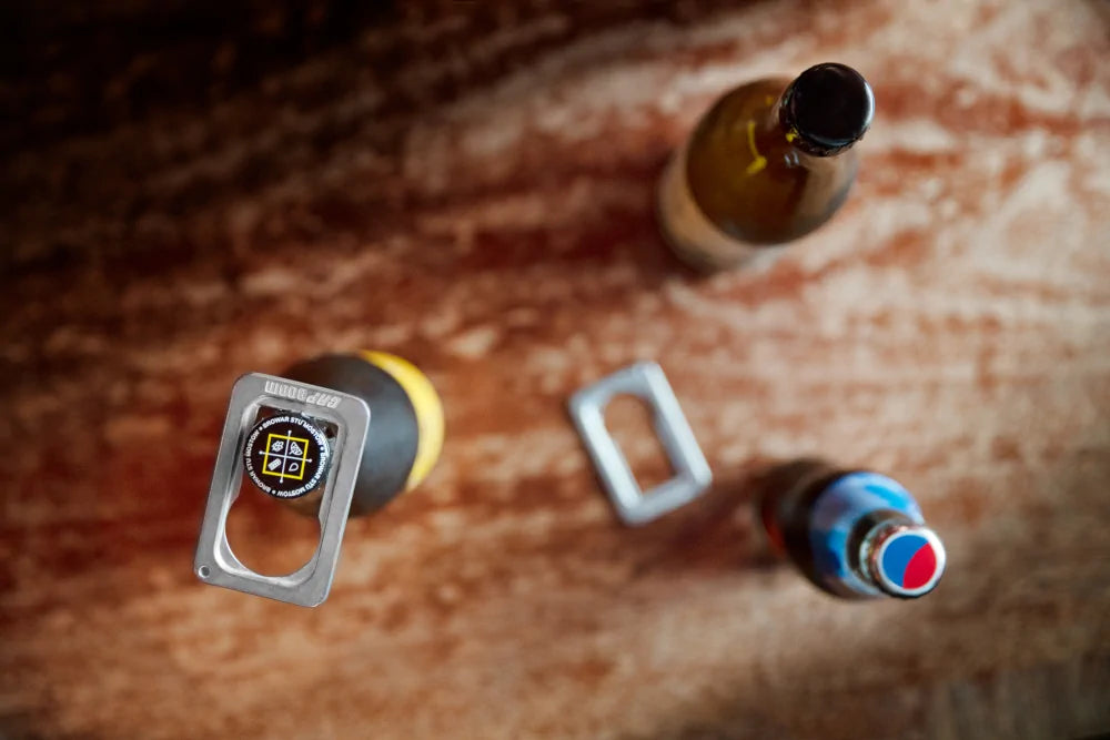 Top view of CapBoom bottle opener with bottles