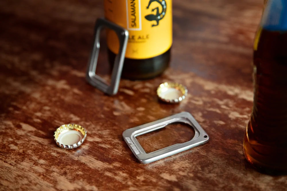 Top view of CapBoom Bottle opener on wooden table