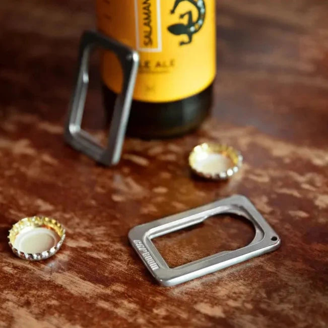To capboom bottle openers on wooden table